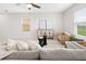 Inviting living area with a plush gray sofa, decorative side chairs, and neutral decor at 2817 Muller Oak Loop, Ocoee, FL 34761