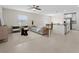 Bright and airy living room with modern furnishings and an open floor plan with easy kitchen access at 2817 Muller Oak Loop, Ocoee, FL 34761