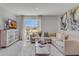 Bright living room with a sectional sofa, stylish decor, and a view of the water at 2880 Grayton St, Deltona, FL 32738