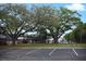 Community playground with swings and a covered picnic area near parking at 3057 Aaron Burr Ave # 1, Winter Park, FL 32792