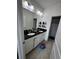 This bathroom features double sinks and a granite countertop, providing ample space and functionality for everyday routines at 306 Captiva Dr, Davenport, FL 33896