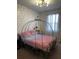 This bedroom features a canopy bed, creating a magical and enchanting atmosphere, perfect for imaginative play at 306 Captiva Dr, Davenport, FL 33896