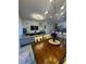 Open concept living space seamlessly connecting the living, dining, and kitchen areas at 306 Captiva Dr, Davenport, FL 33896