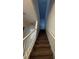 Carpeted staircase with white railing leading to the upper level at 306 Captiva Dr, Davenport, FL 33896