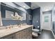 Bathroom with double vanity, marble countertop, and a walk-in shower, with a white flower arrangement at 315 Lake Rd, Lake Mary, FL 32746