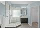 This remodeled bathroom features a glass shower enclosure, a built-in seat, and decorative tiling at 315 Lake Rd, Lake Mary, FL 32746