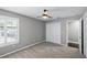 Bright bedroom with ensuite bathroom, spacious closet, ceiling fan, and natural light at 315 Lake Rd, Lake Mary, FL 32746