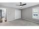 Bright bedroom with ensuite bathroom, spacious closet, ceiling fan, and natural light at 315 Lake Rd, Lake Mary, FL 32746