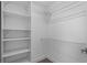 Walk-in closet with white shelving units and metal racks for storage at 315 Lake Rd, Lake Mary, FL 32746