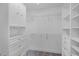 Spacious walk-in closet with white built-in drawers and shelving for optimal organization at 315 Lake Rd, Lake Mary, FL 32746