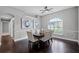 Dining area with hardwood floors, modern lighting and large window at 315 Lake Rd, Lake Mary, FL 32746