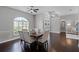 Open-concept dining room with dark wood floors and large windows at 315 Lake Rd, Lake Mary, FL 32746