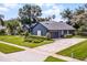 Landscaped home featuring a two-car garage and ample driveway space at 315 Lake Rd, Lake Mary, FL 32746