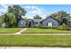 Inviting home exterior with a lush green lawn and a well-maintained landscape at 315 Lake Rd, Lake Mary, FL 32746