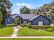 Charming home with a well-manicured lawn, complemented by a walkway leading to a welcoming entrance at 315 Lake Rd, Lake Mary, FL 32746