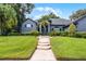 Attractive home featuring a lush lawn and walkway leading to a welcoming front entrance at 315 Lake Rd, Lake Mary, FL 32746