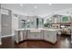Open kitchen concept with stainless steel appliances, an island, and views of the pool at 315 Lake Rd, Lake Mary, FL 32746