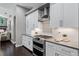 Modern kitchen featuring stainless steel appliances, white cabinets, and stylish tile backsplash at 315 Lake Rd, Lake Mary, FL 32746