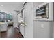 Well-equipped kitchen with stainless appliances, white cabinets, and a view into the living space at 315 Lake Rd, Lake Mary, FL 32746