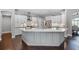 Expansive kitchen featuring a large island with seating, sleek countertops, and an open layout perfect for entertaining at 315 Lake Rd, Lake Mary, FL 32746