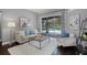 Cozy living room with stylish decor and a view of the screened-in pool area at 315 Lake Rd, Lake Mary, FL 32746