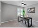Home office with a ceiling fan, a black desk, a chair, and a window with natural light at 315 Lake Rd, Lake Mary, FL 32746