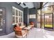Screened patio with seating area, ceiling fan, and access to the yard through the screen door at 315 Lake Rd, Lake Mary, FL 32746
