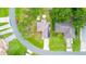 Aerial shot of a property with visible boundaries, roof, solar panels and surrounding neighborhood at 339 Colony Ct, Kissimmee, FL 34758