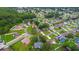 Aerial view of a residential area featuring well-manicured lawns and tree-lined streets at 339 Colony Ct, Kissimmee, FL 34758