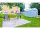 Enjoy outdoor living in this backyard with a shed, a patio, and plenty of space at 339 Colony Ct, Kissimmee, FL 34758