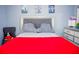 Comfortable bedroom with plush pillows, stylish headboard, and modern decor, creating a relaxing retreat at 339 Colony Ct, Kissimmee, FL 34758