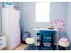 Cozy bedroom with desk, chair, and simple decor, providing a comfortable workspace at 339 Colony Ct, Kissimmee, FL 34758