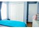 Well-lit bedroom with closet, window, and neutral color scheme at 339 Colony Ct, Kissimmee, FL 34758