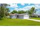 Charming single-story home with well-maintained lawn and attached two car garage on a sunny day at 339 Colony Ct, Kissimmee, FL 34758