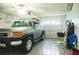 View of the two-car garage featuring a silver SUV and a ceiling fan at 339 Colony Ct, Kissimmee, FL 34758
