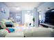 Bright living room featuring tile flooring, white sofas, and large windows for natural light at 339 Colony Ct, Kissimmee, FL 34758