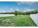 This backyard is fenced and has a small lawn at 3408 Curlew Ave, Leesburg, FL 34748