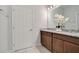 Bathroom boasts double vanity with granite countertops, ample cabinet space, and a clean design at 3408 Curlew Ave, Leesburg, FL 34748