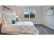 Cozy bedroom with a large window and hardwood flooring at 3408 Curlew Ave, Leesburg, FL 34748