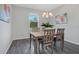 A contemporary dining room features modern lighting and an open window at 3408 Curlew Ave, Leesburg, FL 34748