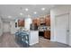 Modern kitchen features stainless steel appliances, granite countertops, and breakfast bar with seating at 3408 Curlew Ave, Leesburg, FL 34748