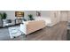A modern living room is designed with stylish accents and hardwood floors at 3408 Curlew Ave, Leesburg, FL 34748