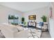 Bright living room with modern decor, stylish furniture, and sliding glass doors to the outdoors at 3408 Curlew Ave, Leesburg, FL 34748