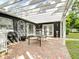 View of the outdoor patio area with brick flooring and a pergola at 3417 Pershing Ave, Orlando, FL 32812
