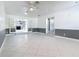 Large basement with tile floors and access to living room at 3417 Pershing Ave, Orlando, FL 32812