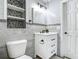 Modern bathroom features vanity and a gray tile walls at 3417 Pershing Ave, Orlando, FL 32812