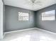 Inviting bedroom with natural light from the windows and modern gray walls at 3417 Pershing Ave, Orlando, FL 32812