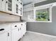 Bright dining area featuring white cabinetry and granite counters at 3417 Pershing Ave, Orlando, FL 32812