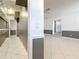 Bright hallway with tiled floor and well organized storage shelves, leading to adjacent rooms at 3417 Pershing Ave, Orlando, FL 32812