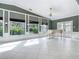 Spacious living room with decorative windows providing ample natural light and outside views at 3417 Pershing Ave, Orlando, FL 32812